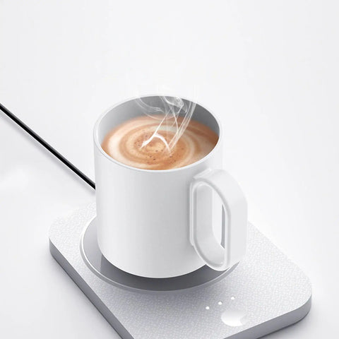 Kick Those Cold Coffee Sips To The Curb With This Electric Desk Mug Warmer Featuring Three Custom Temperature Settings To Keep Your Daily Grind Piping Hot All Day Long Smart Cup Heater For Office, white mug on warmer with steam.