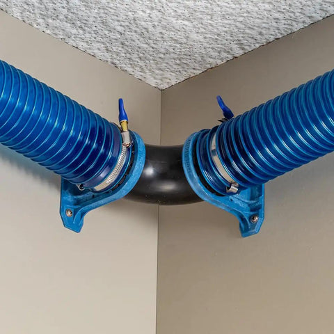 Ready Mount Two And A Half Inch 90 Degree Elbow Dust Collection Connector for Two Hoses Durable ABS Construction installed in corner