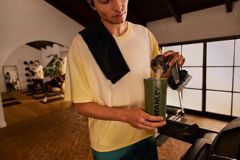 No Sweat Leakproof 20 Oz Hot Pink Shaker Bottle With Secure Hinge Lid And Fast Flow Spout Portable Tritan Protein Cup being filled.