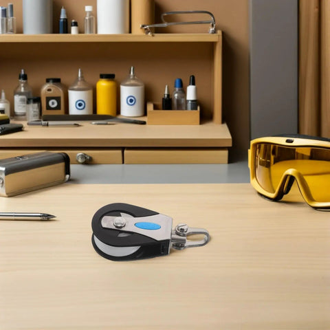 Stainless Steel Nylon Marine Pulley With 209Kg Load Capacity Single Swivel Sailing Block on wooden table with tools