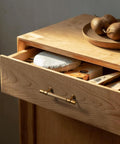 Drawer with Vintage Retro Antique Brass Zinc Alloy Cabinet Handle, 5 inch center, showing durable distressed finish in sunlight