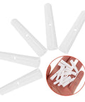 Top Shelf Folding Umbrella Repair Kit With Durable White Plastic Tail Beads And Quick Setup Design For Hassle Free Bone Coverage And Game Changing Weather Defense Slick Replacement Caps showing white plastic caps for umbrella repair.