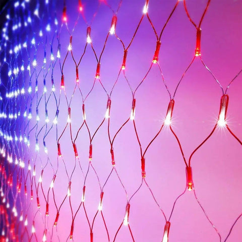 Solar American Flag Net Lights Outdoor 420 LEDs 6.5ft By 3.28ft Epic Bright Flag Mesh Solar Powered Auto On At Dusk No Wiring Maintenance Memorial Day Fourth Of July Yard Decor close-up of red, white, and blue lit net pattern