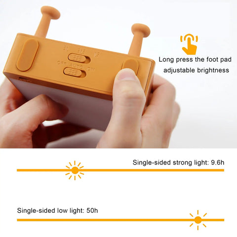 Hands adjusting Toast Shaped Night Light With Cute Smile Face Double Or Single Side LED Toast Lamp for brightness settings.