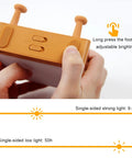 Hand adjusting Cool Toast Bread LED Night Light With Rechargeable Battery Portable Bedside Lamp showing brightness modes