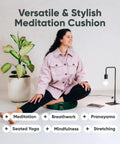 Lux Velvet Meditation Cushion For Posture Support, Large Zafu Yoga Floor Pillow With Buckwheat Hull Fill, Removable Washable Cover, Carry Handle, Round Green Cushion For Mindful Relaxation And Longer Sitting Sessions. Woman seated on green round meditation cushion for breathwork and stretching.