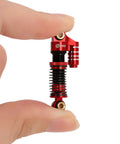 Close-up of red Beefy 45mm Aluminum Threaded Shock Absorbers With Oil Dampers for FCX24 1/24 RC Crawler Upgrade in hand