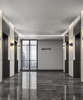 Set Of Two Dope Matte Black Wall Sconces With Frosted Glass Shades in modern hallway lighting.