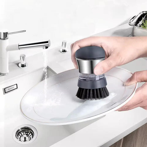 Stainless Steel Dish Scrubber With Built In Soap Dispenser used to clean plate in kitchen sink