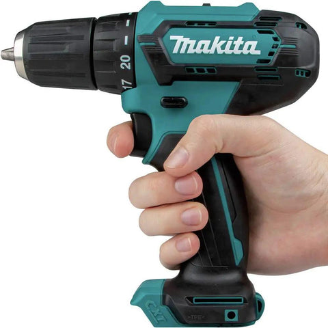 Person holding Compact 12V Max Cordless Driver Drill With Three Eighths Inch Chuck, dual speed, rubberized soft grip handle.