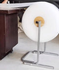 Floorstanding Bubble Wrap Roll Dispenser Heavy Duty Vertical Packaging Stand 59 Inches tall holding bubble wrap roll on a smooth floor.