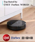 Ultra Slim Robot Vacuum With Dope Suction Quiet Clean Self-Charging Dock Cleans Hardwood Floors To Low-Pile Carpet 2.85 Inch Profile Up To 100 Minutes Of Cleaning Power Black on hardwood floor next to furniture
