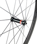 Close-up of Beefy 50mm Deep Carbon Wheelset Tubeless Ready With Basalt Braking Surface EN And UCI Approved Novatec hub