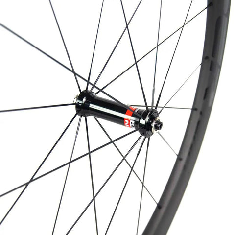Close-up of Beefy 50mm Deep Carbon Wheelset Tubeless Ready With Basalt Braking Surface EN And UCI Approved Novatec hub