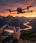 Mavic 4 Pro Drone Fly More Combo Bundle for creators controlling drone over mountain landscape at sunset