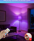 Lit Color Changing LED Bulb With Remote RGB 6 Modes Dimmable E26 Base in a living room, showing remote control use and ambient lighting.