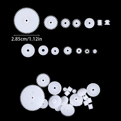 200Pcs 0.5 Module Plastic Gear Set for Small Motors with various worm, crown, and spindle gears on black background
