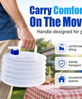 Collapsible Water Container With Spigot And Hook For Camping And Hiking BPA Free Foldable Water Storage Jug in use, hand holding handle