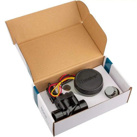Open box with Wireless Battery Powered Sprinkler Timer With 1 Inch PGV Valve And Solenoid, waterproof irrigation components visible.
