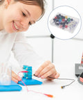 Student using Molecular Modeling Kit For Chemistry Students With 63 Atom Balls And 86 Bond Pieces in classroom setting.