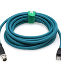 M12 Ethernet 8 Pin X Code To RJ45 CAT 7e GigE Cable coiled on white background