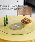 Hella Smooth 360 Swivel Tempered Glass Lazy Susan Turntable Nailed It rotating dining tray on a yellow table with snacks and drinks.