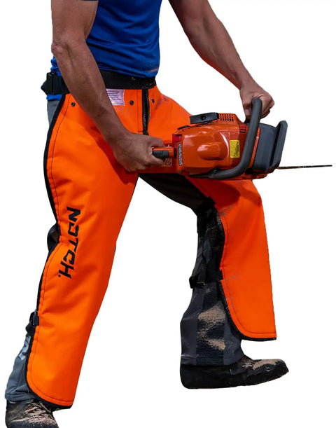 Person wearing Hi Vis Safety Orange Apron Style Chainsaw Chaps Type A Frontal Protection 5 Layer Chain Stopping Protective Fiber UL