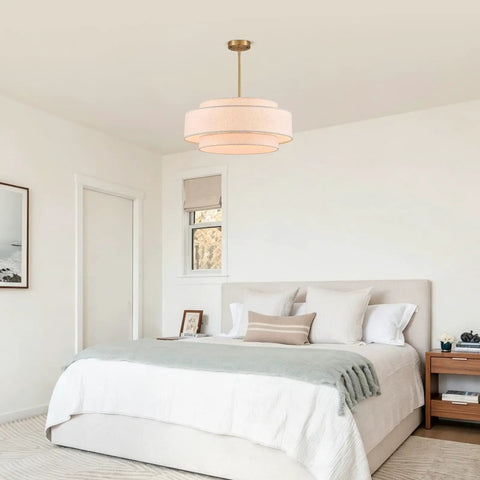 Totally Iconic 24 Inch Linen Drum Chandelier With Six Warm Lights Featuring Sleek Gold Frame And Three Tier Vintage Farmhouse Design in a bedroom