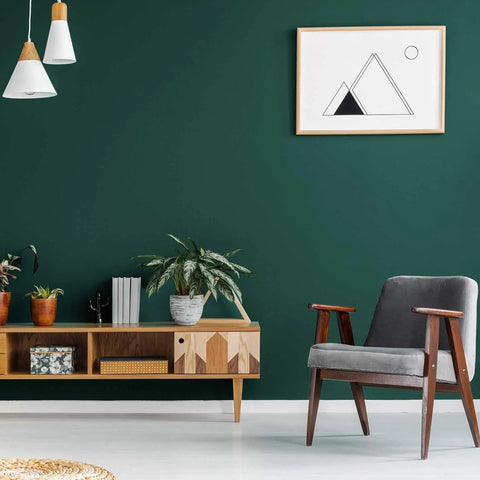 Living room with Dark Green Peel And Stick Wallpaper Removable Vinyl Self Adhesive Wall Covering For Counters Cabinets And Rooms Renter Friendly Large Roll With Grid Cut Guide 15.7 Inches By 315 Inches on wall behind chair and plants.