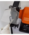 Upgrade Your Workshop With This Compact Vertical Belt Sander And Bench Grinder Combos, showing tool sharpening with clear protective shield.