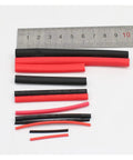 Essential 42-Piece Black And Red Heat Shrink Tubing Kit For Electrical Wiring Projects. Heavy Duty Insulation Sleeves Protect Cables From Moisture And Damage While Making Repairs Super Easy To Finish Fast. black and red tubes with ruler