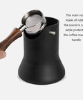 Solid Daily Driver Coffee Knock Box Equipped With Silent Rubber Tamper Rod and Impact Resistant ABS Body next to a metal portafilter.