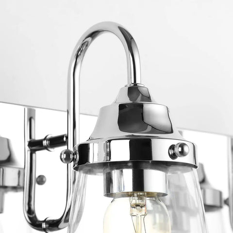 Close-up of Chrome Vanity Light Fixture For Bathroom Three Light Farmhouse Style Over Mirror With Clear Glass Shades Bulbs Not Included