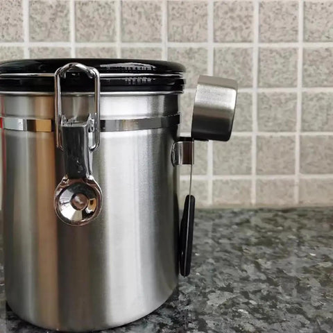 Rock Solid 304 Stainless Steel Coffee Canister Featuring One Way Degassing Valve And Rotatable Date Tracker Keeps Your Daily Grind Fresh And Legit Snap Tight Airtight Tea Storage Container on kitchen counter.
