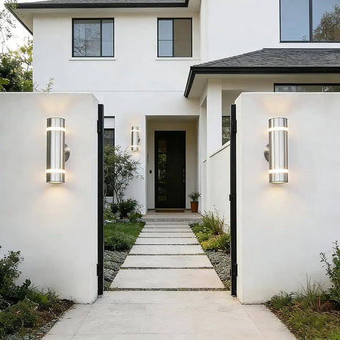 Dope Modern Cylinder Outdoor Wall Light Stainless Steel Porch Sconce With Nickel Finish illuminating entrance.