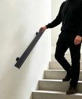 Tough As Nails Flush Wall Mount Handrail Made From Premium Stainless Steel for secure indoor steps, installed on a sleek white wall.