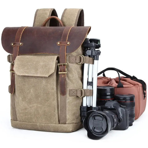 Canvas DSLR Video Backpack With Waterproof Outdoor Design, Shock Resistant Shell, cameras, lenses, tripod, and gear on display