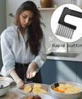Front view of a crinkle-cut veggie knife with black handle and stainless-steel wavy blade, used for slicing potatoes and carrots.