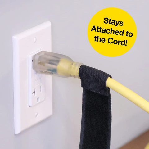 Selfie Straps 12 Inch 8 Pack Black Super Handy Stretchy Hook and Loop Cord Organizer attached to a power cord and socket.