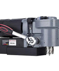 Badass Low Profile Magnetic Drill Press With Beefy 9.5 Amp Motor And Insane 2645 Pound Holding Force Cuts Clean Holes Up To 1-7/16 Inches In Metal Fabrication Jobs side view of durable drill press with a compact design.
