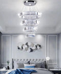 Four Ring LED Crystal Chandelier With Adjustable Ring Sizes in a modern bedroom, stainless steel and K9 crystal, cool white light
