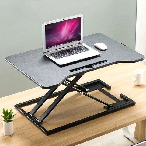 Portable Sit Stand Desk Converter With Heavy Duty Dual Tray Ergonomic Stand on wooden surface with laptop and mouse.