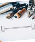 Beefy Heavy Duty Hinge Adjustment Wrench Tool For Door Repair on a table with other tools, precise hinge gap alignment