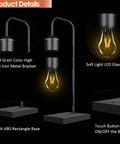 Lit Magnetic Levitating Light Bulb Lamp With Black Base showing wood grain metal bracket and glowing LED bulb detail