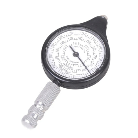 Heavy Duty Rock Solid Map Distance Measurer Built Like A Tank For Spot On Tracking And No Sweat Handling On Rough Outdoor Job Sites By Seasoned Surveyors And Engineers showing a circular measuring tool with a silver dial.