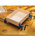 Beefy Extra Wide 3/4 Inch Pipe Clamps For Woodworking with 2-1/2 Inch Jaws securing wooden frame on a workbench