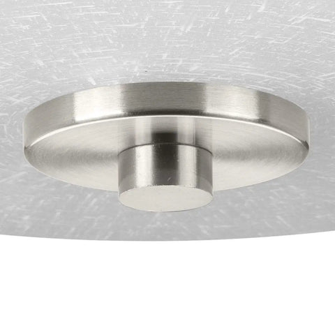 Close-up of Alexa Collection Two-Light Flush Mount Ceiling Light in satin nickel with textured shade and decorative knob.