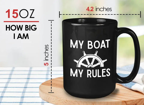 My Boat My Rules Nautical Ceramic Coffee Mug FifteenOz Black with steering wheel design on table