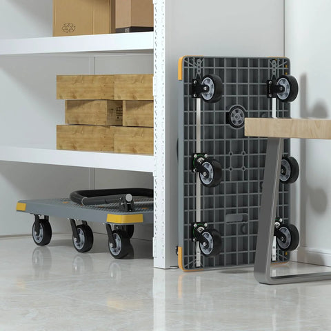 Foldable Heavy Duty Platform Cart With 1764 Pound Capacity stored upright against a wall, showcasing six wheels including a spare