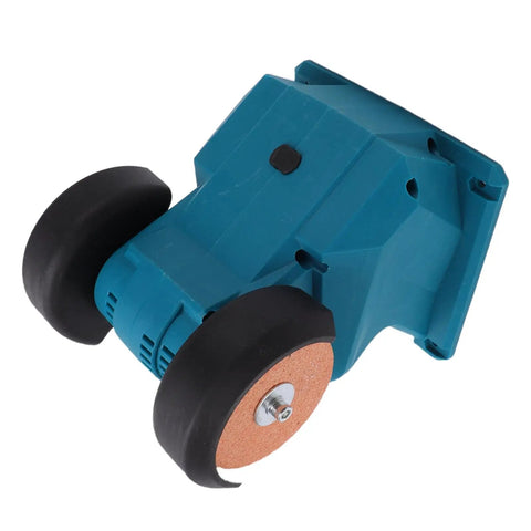 Badass Cordless Mini Bench Grinder Featuring Dual Grinding Wheels And A Rock Solid Suction Mount For Zero Vibration Sharpening And Precision Workshop Projects, side view with blue casing and rubber wheels.